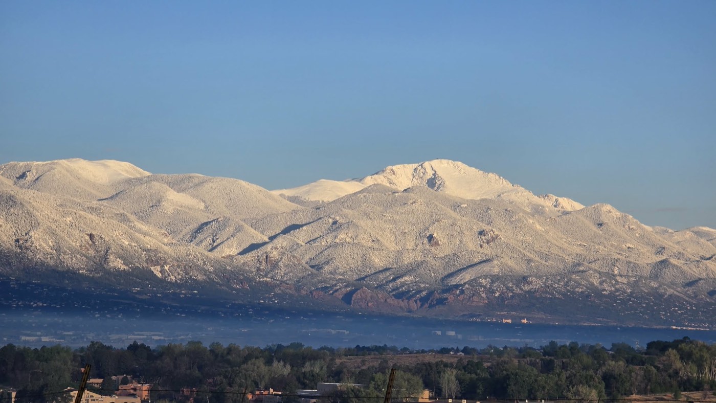 Snow-covered Pikes Peak under a clear blue sky